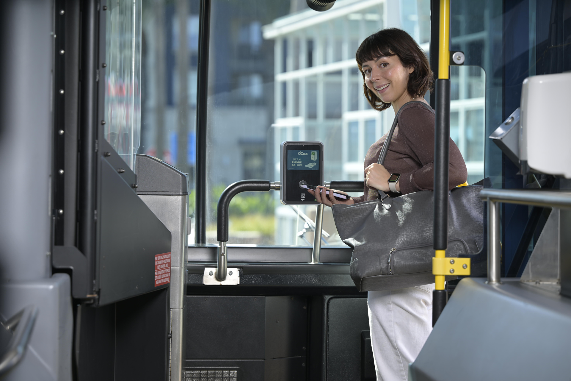 Woman boarding public transit bus